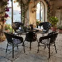 Salon_de_jardin_4_places_en_rotin_PE_tressé_avec_table_ronde_60_cm.webp